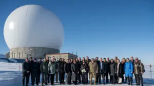 U.S. Space Force Gen. Chance Saltzman and guests stand before a radar dome at Pituffik Space Base, Greenland, April 5, 2023.