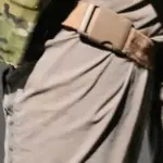 Cropped view of tactical gear worn by enforcement officers during an immigration operation in Florida.