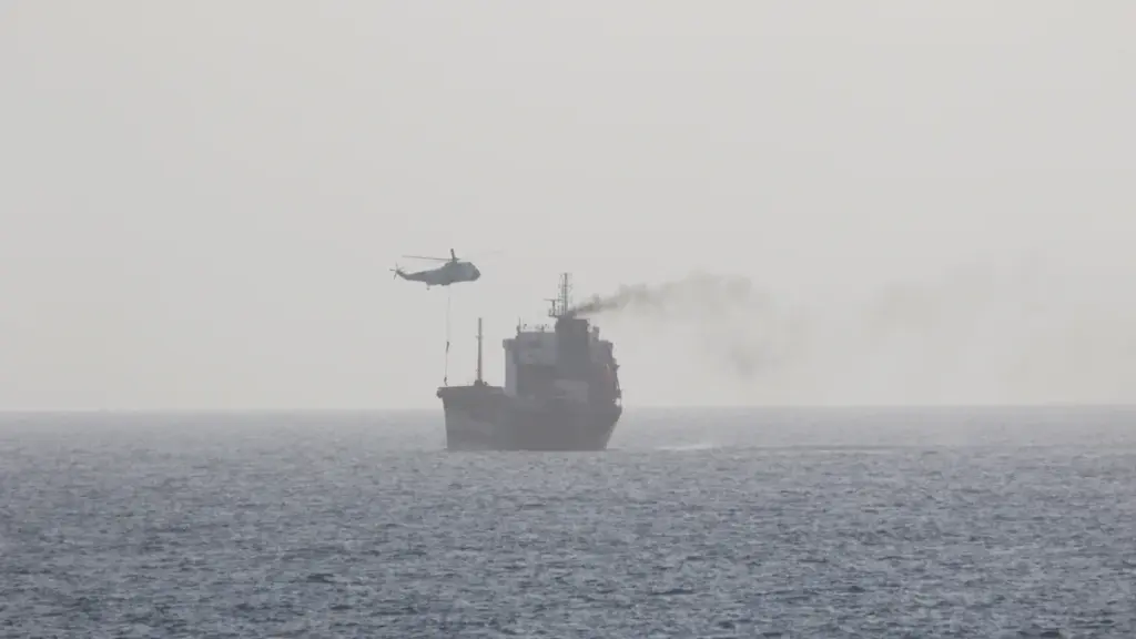 High-angle aerial photograph of a loaded commercial motor tanker vessel transiting open international waters in the Gulf region.