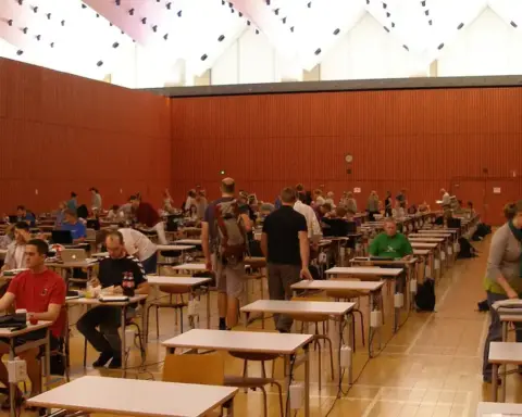 Rows of students seated at desks in an examination hall