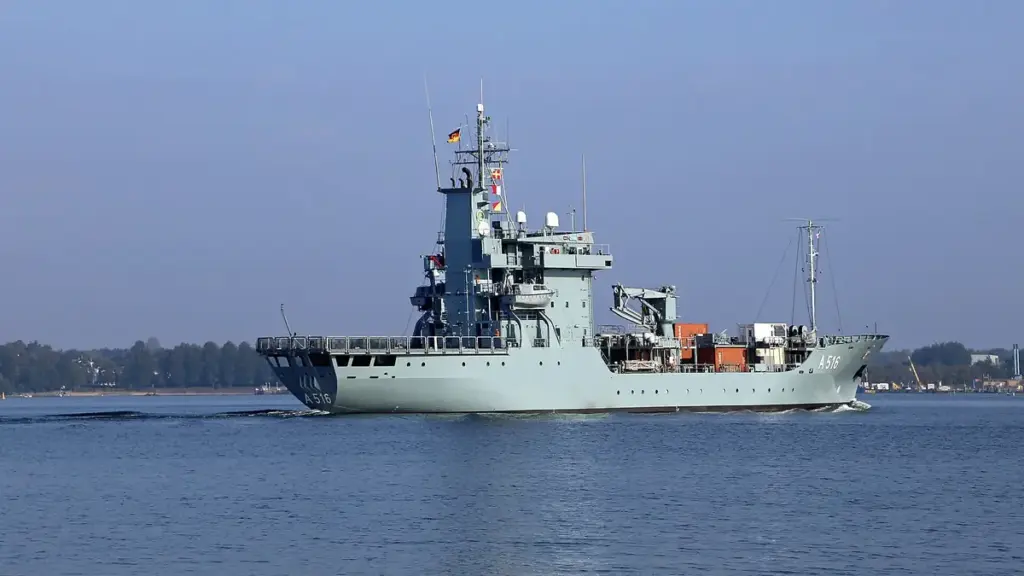 Naval warship sailing on open sea under daylight