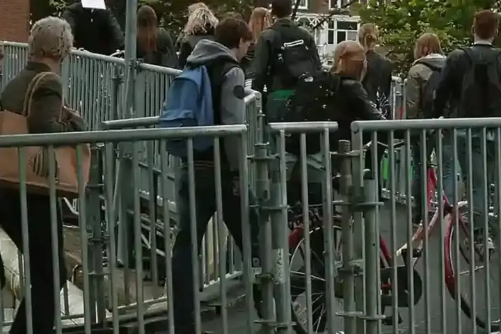 Students walking together across a university campus walkway