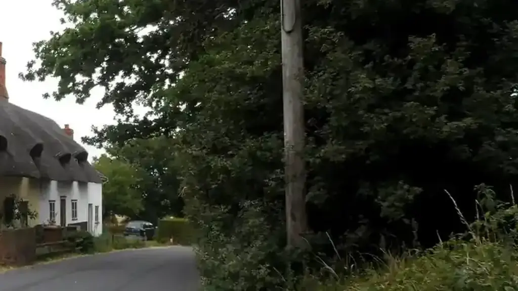 Stone cottages lining a street in an English village