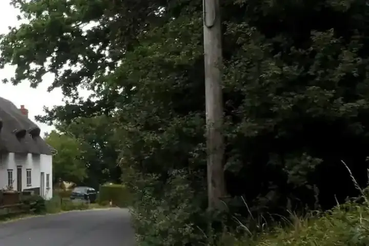 Stone cottages lining a street in an English village