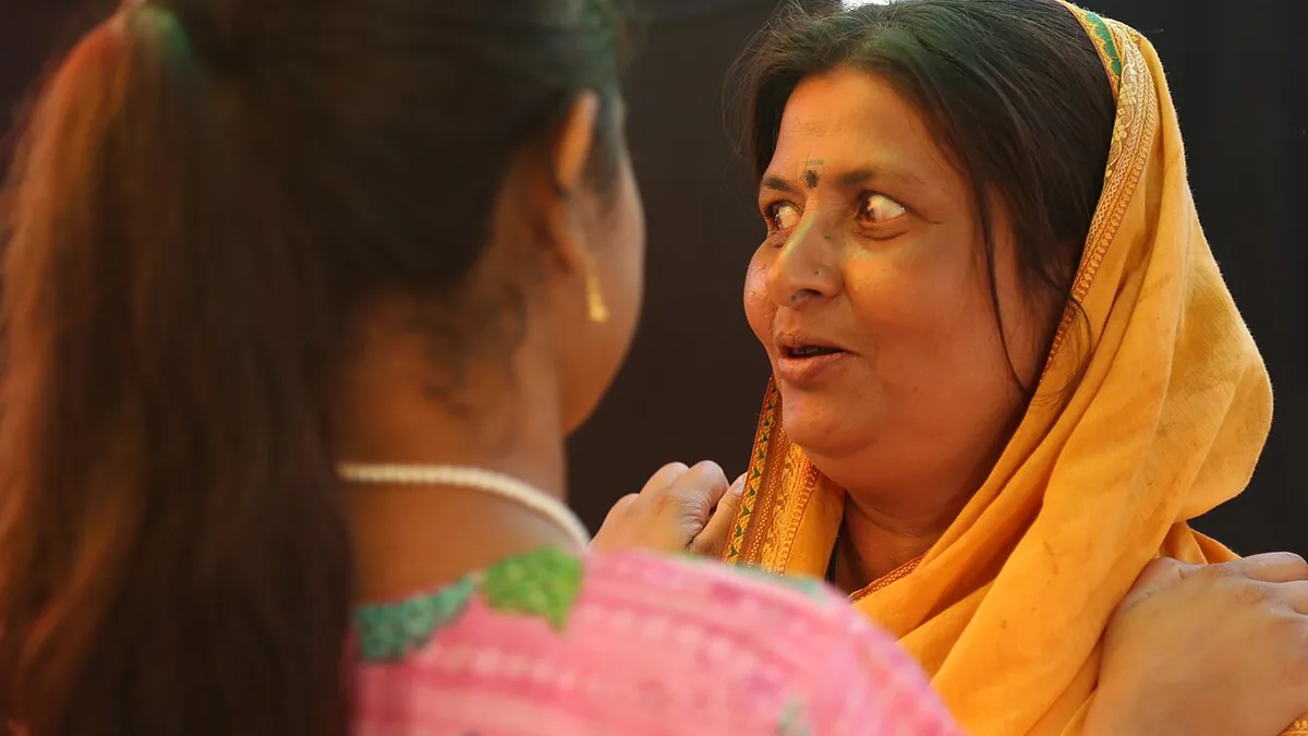 Indian women speaking in a community setting