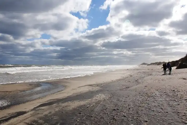 Ocean surf breaking onto a sandy Atlantic coastal beach in the Outer Banks