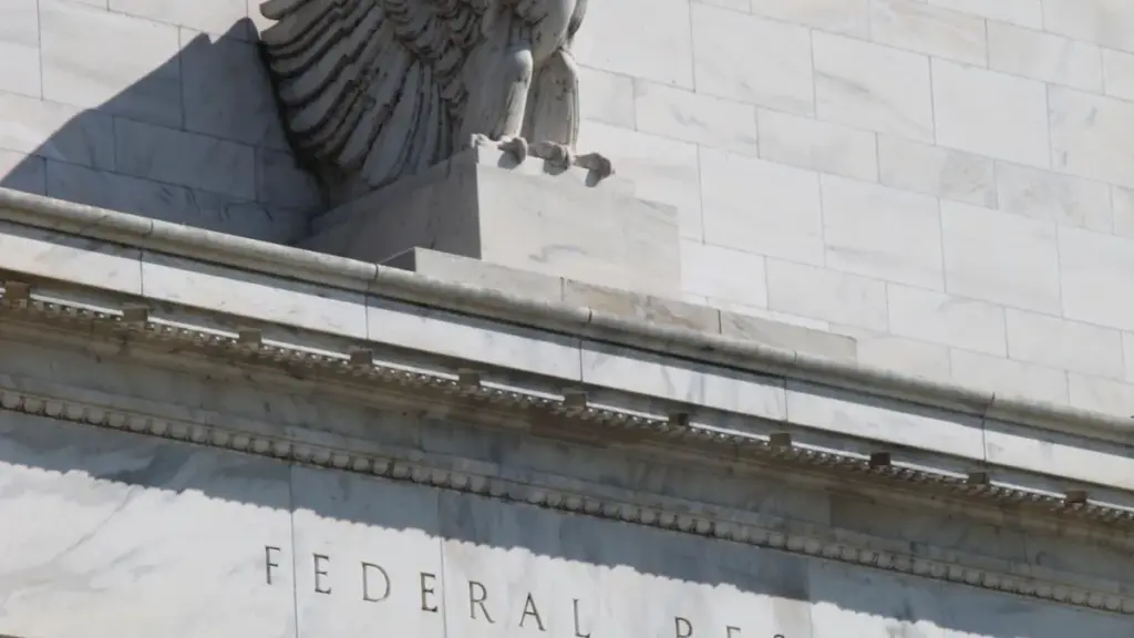 Eagle sculpture and carved pediment at the Federal Reserve Building entrance in Washington D.C.
