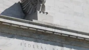 Eagle sculpture and carved pediment at the Federal Reserve Building entrance in Washington D.C.
