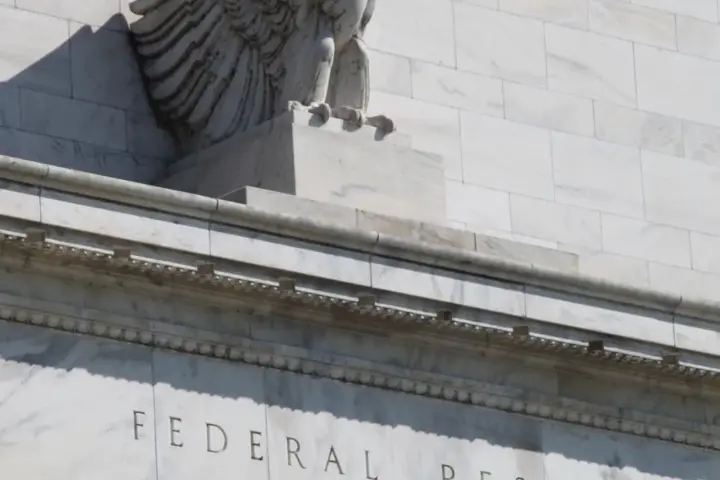 Eagle sculpture and carved pediment at the Federal Reserve Building entrance in Washington D.C.