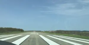 Airport runway with aircraft on tarmac