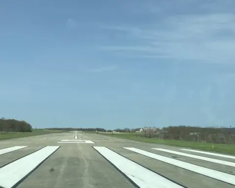 Airport runway with aircraft on tarmac