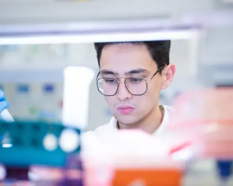 Researcher using precision laboratory pipettes for scientific analysis