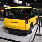 Kia PV-5 concept electric van displayed at an auto show, the vehicle family that includes the new Kia PV7 commercial electric van.