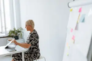 Woman seated in a chair representing menopause brain health and memory research.