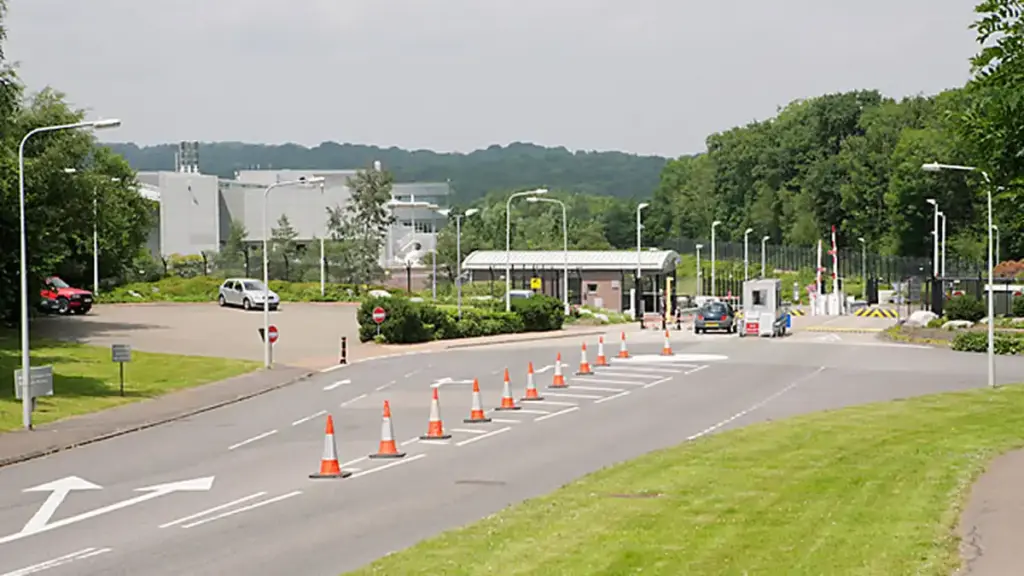 Exterior entrance and security gates of the NATS London Area Control Centre facility in Swanwick, Hampshire.
