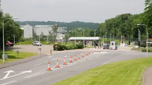 Exterior entrance and security gates of the NATS London Area Control Centre facility in Swanwick, Hampshire.