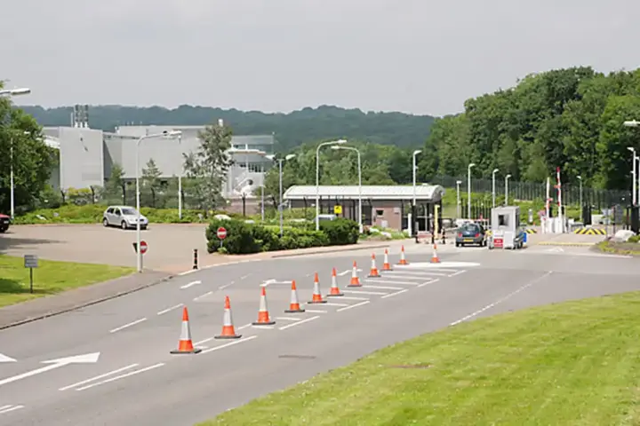 Exterior entrance and security gates of the NATS London Area Control Centre facility in Swanwick, Hampshire.