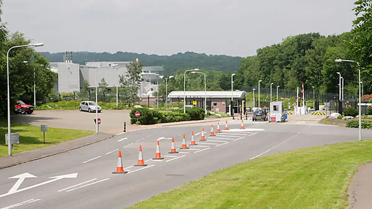 Exterior entrance and security gates of the NATS London Area Control Centre facility in Swanwick, Hampshire.