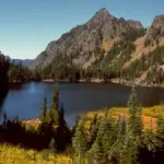 Expansive alpine terrain with steep forested ridges and rock faces in Washington's Olympic National Park.