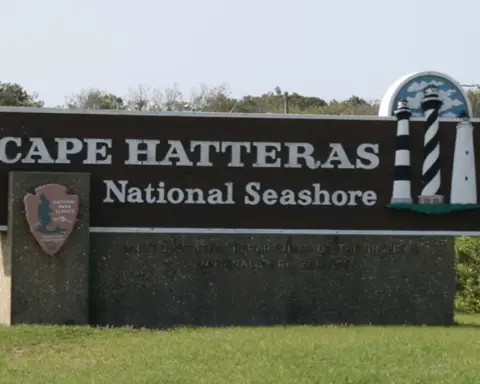 Atlantic ocean waves breaking along the shoreline sandbars at Cape Hatteras National Seashore on the Outer Banks.