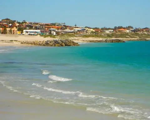 Golden shoreline and breaking coastal surf at Sorrento Beach near Hillarys Boat Harbour in northern metropolitan Perth.