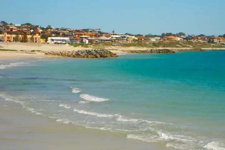Golden shoreline and breaking coastal surf at Sorrento Beach near Hillarys Boat Harbour in northern metropolitan Perth.