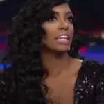 Archival photograph of television personality Porsha Williams smiling during a public studio appearance prior to her health disclosure.