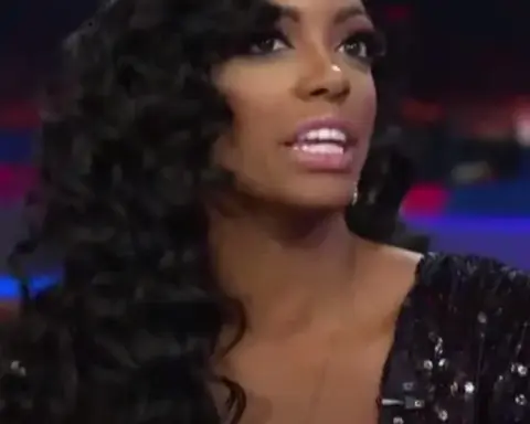 Archival photograph of television personality Porsha Williams smiling during a public studio appearance prior to her health disclosure.