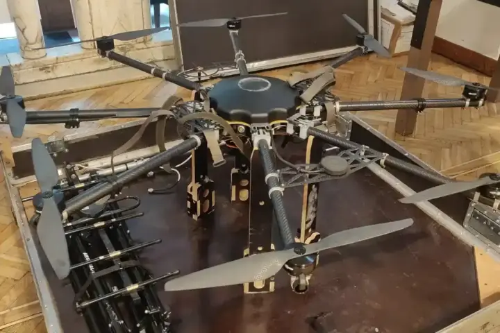 A large Ukrainian drone rests indoors, representing long-range unmanned aircraft used against distant energy infrastructure.