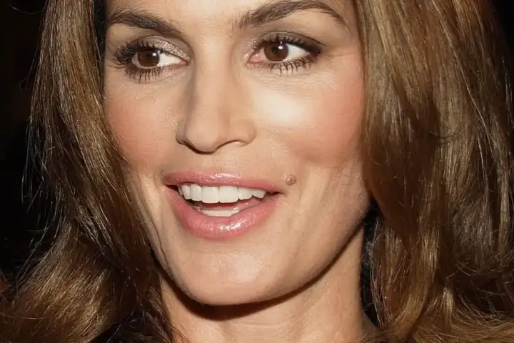 Portrait of Cindy Crawford outdoors during a media appearance.