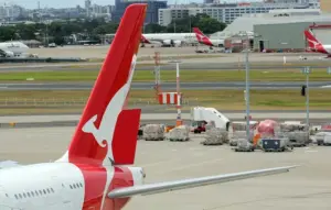 Qantas Boeing 737-800 aircraft at an Australian airport with the airline's red tail visible