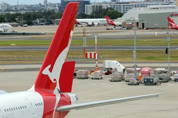 Qantas Boeing 737-800 aircraft at an Australian airport with the airline's red tail visible