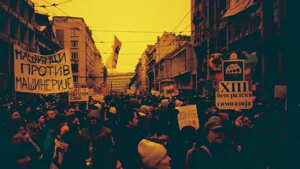 Protesters holding banners in Belgrade during anti-corruption demonstrations