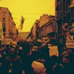 Protesters holding banners in Belgrade during anti-corruption demonstrations