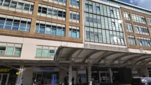 Exterior view of a modern NHS hospital building in London during daylight, used as context for hospital heat risk reporting.
