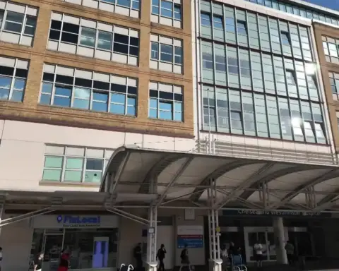 Exterior view of a modern NHS hospital building in London during daylight, used as context for hospital heat risk reporting.