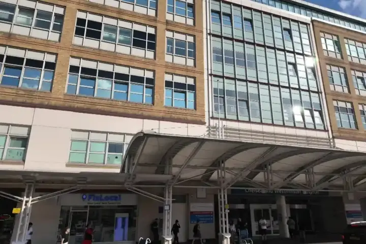 Exterior view of a modern NHS hospital building in London during daylight, used as context for hospital heat risk reporting.