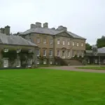 Palladian stone frontage of Dumfries House in Ayrshire, Scotland, where King Charles hosted an AI summit.