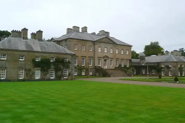 Palladian stone frontage of Dumfries House in Ayrshire, Scotland, where King Charles hosted an AI summit.