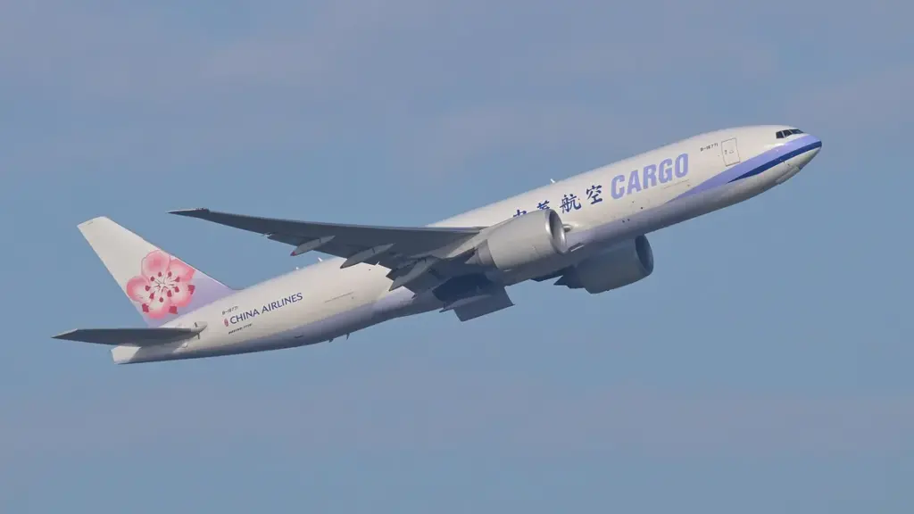 Boeing 777 freighter aircraft departing from an airport runway during cargo operations