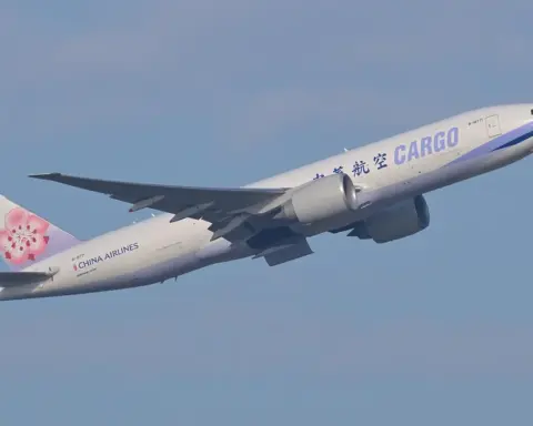 Boeing 777 freighter aircraft departing from an airport runway during cargo operations