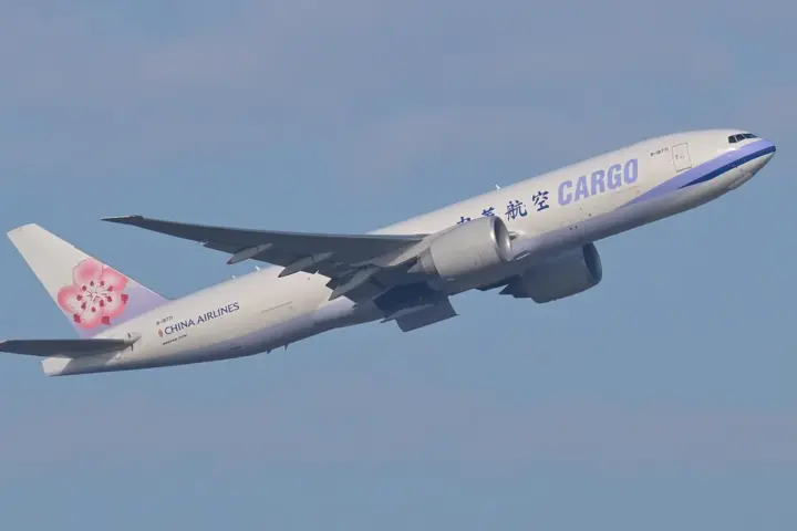 Boeing 777 freighter aircraft departing from an airport runway during cargo operations