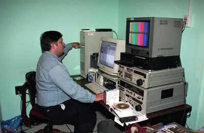 Television editing room with monitors and production equipment arranged for post-production work.