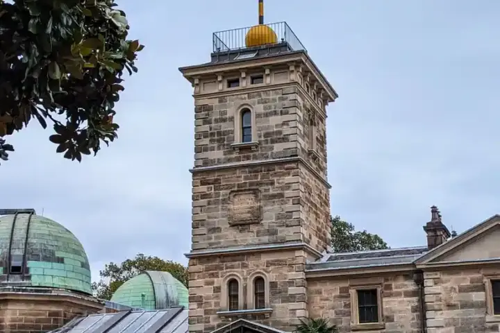 Historic sandstone building of Sydney Observatory on Observatory Hill against an open sky
