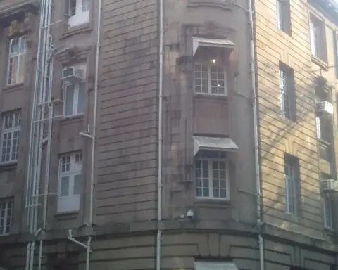 Exterior stone facade of Bombay House, the corporate headquarters of Tata Sons on Homi Mody Street in Mumbai