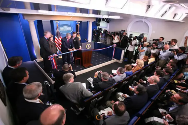 The James S. Brady Press Briefing Room inside the White House showing the official briefing lectern and assigned correspondent seating rows