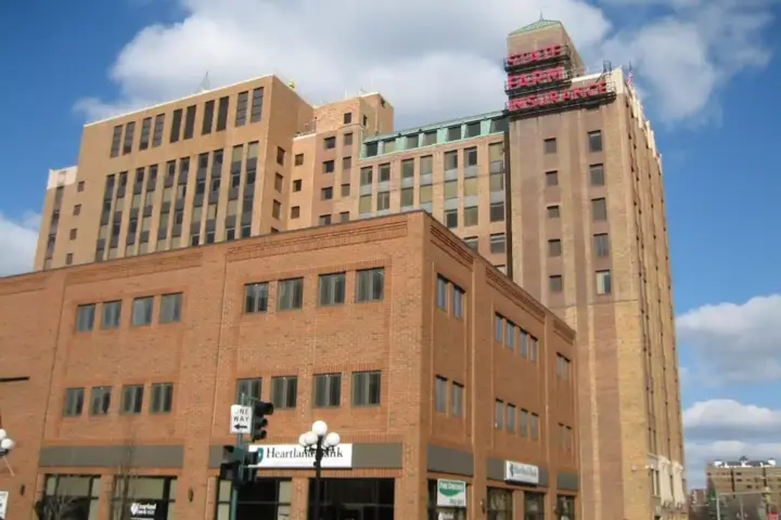 Exterior street view of the State Farm Insurance corporate commercial building in downtown Bloomington, Illinois.
