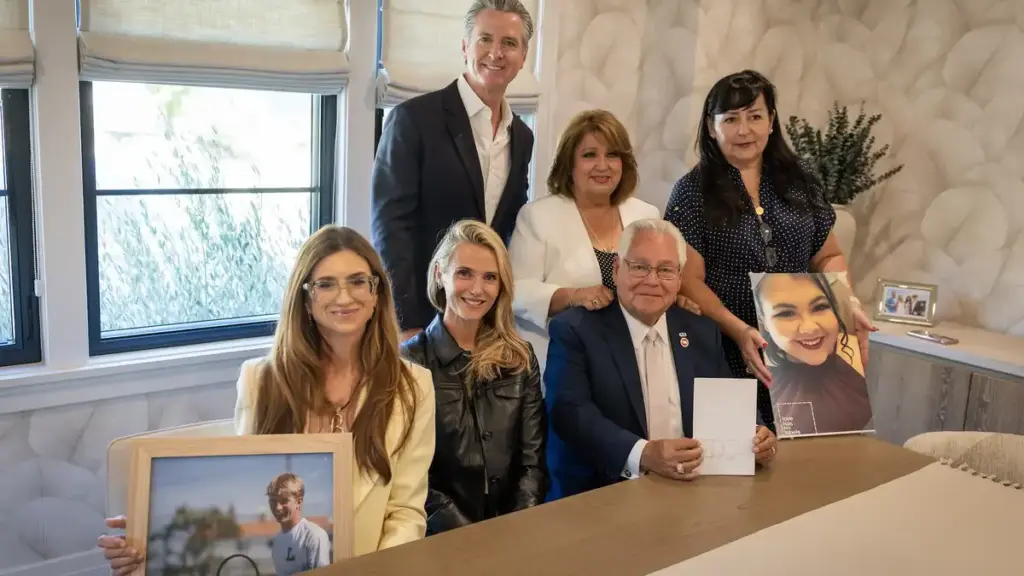 California Governor Gavin Newsom with officials and family members during Braun’s Law signing event