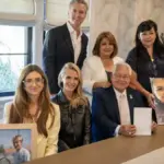 California Governor Gavin Newsom with officials and family members during Braun’s Law signing event