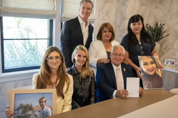 California Governor Gavin Newsom with officials and family members during Braun’s Law signing event